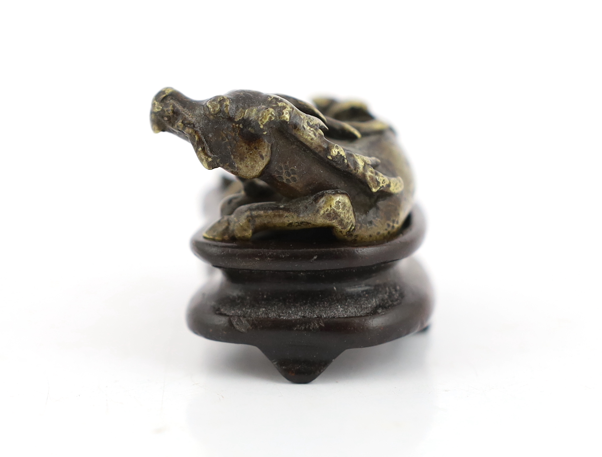 A Chinese bronze weight, in the form of a recumbent deer, late Ming/early Qing dynasty